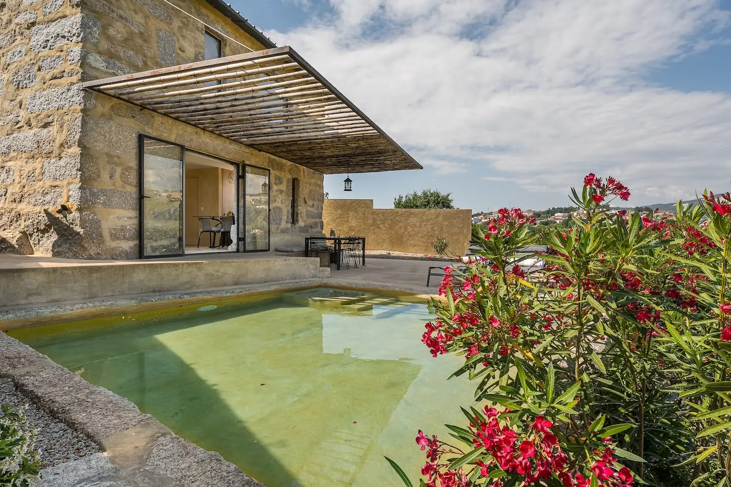 Stone house and pool at Casa dos Limões in Penafiel